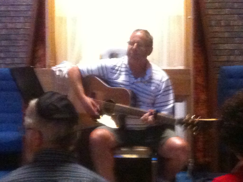 Dr. Dan playing guitar at a Kabbalat Shabbat service