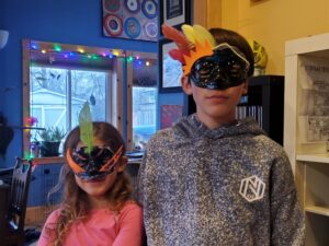 Kids wearing Purim masks